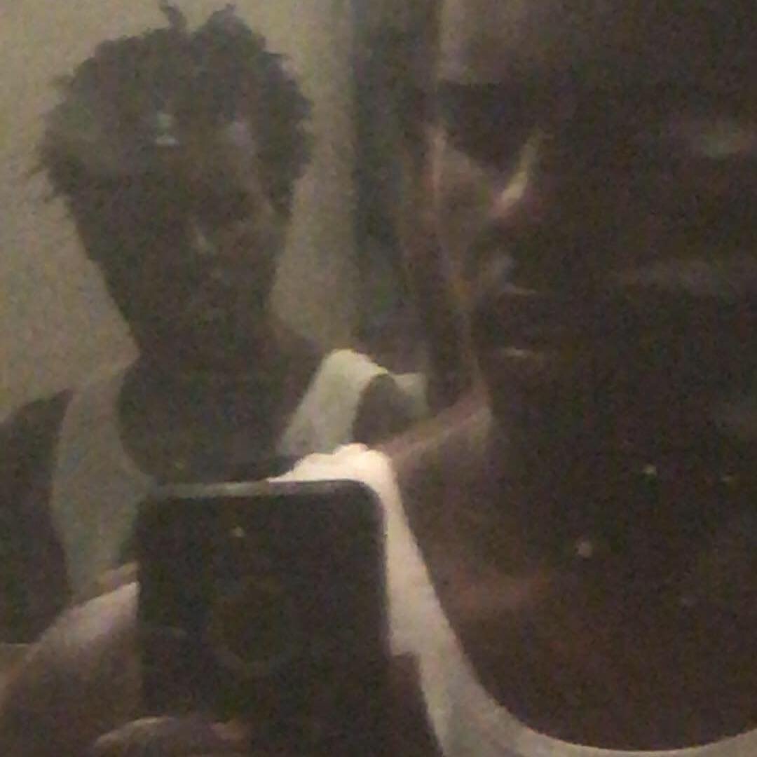 Mirror selfie, low-light portrait